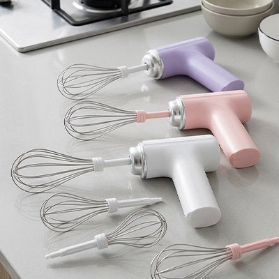 Fouets électriques portables rechargeables en violet, rose et blanc